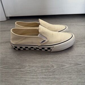 Vans cream slip on sneakers